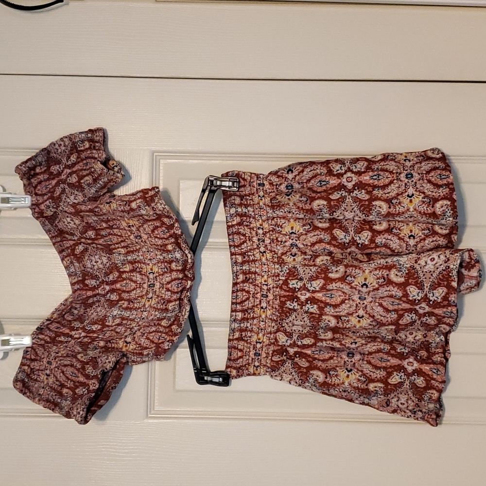 Crop top with matching short skirt.